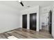 Spacious bedroom with hardwood floors, a ceiling fan, and a walk-in closet at 4501 24Th S Ave, St Petersburg, FL 33711