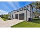 Modern two-story home with black trim, two-car garage, and professional landscaping at 4501 24Th S Ave, St Petersburg, FL 33711
