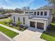 A modern two-story home with an attached two-car garage, modern design, and well-maintained landscaping at 4501 24Th S Ave, St Petersburg, FL 33711