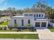 Modern two-story home with dark trim, two-car garage, and manicured landscaping at 4501 24Th S Ave, St Petersburg, FL 33711