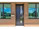 Modern front door with sleek design, wood-grain accents, and address number displayed, enhancing curb appeal at 4501 24Th S Ave, St Petersburg, FL 33711