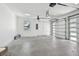 An empty garage offers ample space and features an automatic door and a small window at 4501 24Th S Ave, St Petersburg, FL 33711