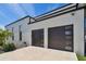 Modern home exterior showing attached two car garage doors at 4501 24Th S Ave, St Petersburg, FL 33711