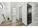 Hallway view showcasing hardwood floors, modern lighting, and doors leading to rooms at 4501 24Th S Ave, St Petersburg, FL 33711