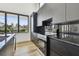 Contemporary kitchen features black marble countertops and backsplash, wood floors, and stainless steel oven at 4501 24Th S Ave, St Petersburg, FL 33711