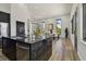 Modern kitchen with a black marble island, open floor plan, and contemporary design at 4501 24Th S Ave, St Petersburg, FL 33711