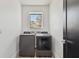 Modern laundry room featuring new washer and dryer, and a window at 4501 24Th S Ave, St Petersburg, FL 33711