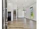 Bright living room featuring sleek flooring, a contemporary ceiling fan, and plentiful natural light at 4501 24Th S Ave, St Petersburg, FL 33711