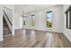 Spacious living area with wood flooring, tall windows, and a staircase at 4501 24Th S Ave, St Petersburg, FL 33711