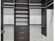 Spacious walk-in closet features dark shelving, drawers, and ample storage space for organization at 4501 24Th S Ave, St Petersburg, FL 33711