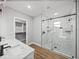 Modern bathroom features a double vanity with a glass-enclosed walk-in shower at 5433 Chestnut Ridge Rd, Dade City, FL 33523