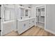 Elegant bathroom featuring double vanity, modern fixtures, and a walk-in closet at 5433 Chestnut Ridge Rd, Dade City, FL 33523