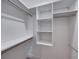 Walk-in closet featuring built-in shelving and hanging rods at 5433 Chestnut Ridge Rd, Dade City, FL 33523