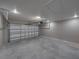Spacious two-car garage with an insulated garage door and electric opener at 5433 Chestnut Ridge Rd, Dade City, FL 33523