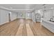 Open living room with recessed lighting and a modern kitchen with stainless steel appliances at 5433 Chestnut Ridge Rd, Dade City, FL 33523