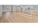 Expansive living room featuring recessed lighting, wood floors, and ample natural light at 5433 Chestnut Ridge Rd, Dade City, FL 33523