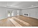 Bright living room with modern fireplace and French doors to the backyard at 5433 Chestnut Ridge Rd, Dade City, FL 33523