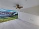 Covered patio with views of the backyard and a ceiling fan at 5433 Chestnut Ridge Rd, Dade City, FL 33523