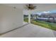 Covered patio features an outdoor ceiling fan, offering a comfortable space at 5433 Chestnut Ridge Rd, Dade City, FL 33523