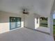 Covered patio featuring double door access to the house and a ceiling fan at 5433 Chestnut Ridge Rd, Dade City, FL 33523