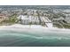 Stunning aerial view of beachfront condos with pristine white sand and turquoise waters at 6310 Midnight Pass Rd # 204N, Sarasota, FL 34242