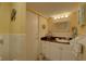 Simple, traditional bathroom with a single sink vanity and decorative nautical accents at 6310 Midnight Pass Rd # 204N, Sarasota, FL 34242