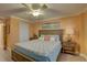 Comfortable bedroom with a king-size bed, coastal-themed decor, and a side table with a lamp at 6310 Midnight Pass Rd # 204N, Sarasota, FL 34242