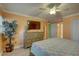 Bright and airy bedroom with a king-size bed, a dresser, and a large window for natural light at 6310 Midnight Pass Rd # 204N, Sarasota, FL 34242