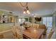 Inviting dining area featuring modern decor, elegant table setting, and open layout to living room at 6310 Midnight Pass Rd # 204N, Sarasota, FL 34242
