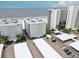 Beautiful low-angle shot of modern condo buildings with covered parking and well-maintained landscaping at 6310 Midnight Pass Rd # 204N, Sarasota, FL 34242