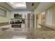 This functional kitchen features granite counters, stainless appliances, and a passthrough to the bedroom at 6310 Midnight Pass Rd # 204N, Sarasota, FL 34242