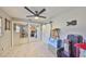 Bedroom featuring mirror sliding closet doors, light colored wood look floors, and modern ceiling fan at 6791 17Th N St, St Petersburg, FL 33702