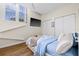 Comfortable bedroom with bright windows, wood floors, and spacious closets for ample storage at 701 Mirror Lake N Dr # 216, St Petersburg, FL 33701