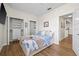 Cozy bedroom featuring a queen bed, modern décor, and well-organized closet space at 701 Mirror Lake N Dr # 216, St Petersburg, FL 33701