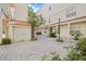 Beautiful courtyard with manicured plants, walkways, and building in background at 701 Mirror Lake N Dr # 216, St Petersburg, FL 33701