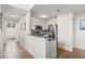 Bright kitchen featuring stainless steel appliances and a convenient breakfast bar at 701 Mirror Lake N Dr # 216, St Petersburg, FL 33701