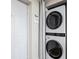 Space-saving stacked washer and dryer conveniently located near the entry door at 701 Mirror Lake N Dr # 216, St Petersburg, FL 33701
