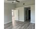 Neutral painted bedroom featuring vaulted ceilings, and view to closet and doorway to other living areas at 7129 Melrose Pl, Bradenton, FL 34203