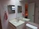 Bathroom featuring vanity, mirror, pink towels and walls, and tile flooring at 8055 Picketts Ct # 1, Weeki Wachee, FL 34613