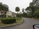 Neighborhood street view with lush trees, landscaping, and clear signage for Picketts Street at 8055 Picketts Ct # 1, Weeki Wachee, FL 34613