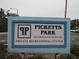 Well-maintained sign for Pickett's Park, highlighting 'The Greens and The Bluffs' and 'Private Recreational Center' at 8055 Picketts Ct # 1, Weeki Wachee, FL 34613