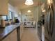 Bright kitchen with white cabinetry, stainless appliances, and a view of the breakfast nook at 8055 Picketts Ct # 1, Weeki Wachee, FL 34613