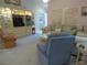Relaxing living room featuring plush sofas, a display cabinet and a glimpse into the laundry area at 8055 Picketts Ct # 1, Weeki Wachee, FL 34613