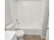 Bathroom with white tiled shower/tub combination, modern vanity and neutral color palette at 8659 Fancy Finch Dr # 202, Tampa, FL 33614