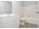 Clean bathroom featuring a shower and bathtub combination and updated vanity at 8659 Fancy Finch Dr # 202, Tampa, FL 33614