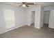 Bright bedroom with a view into the bathroom and closet space at 8659 Fancy Finch Dr # 202, Tampa, FL 33614