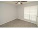 Bedroom with a ceiling fan, window with blinds, and wood-look flooring at 8659 Fancy Finch Dr # 202, Tampa, FL 33614