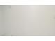 A walk-in closet features white walls and wire shelving at 8659 Fancy Finch Dr # 202, Tampa, FL 33614