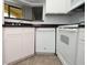 Efficient kitchen featuring a dishwasher, smooth cooktop, and ample storage at 8659 Fancy Finch Dr # 202, Tampa, FL 33614