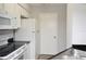 Efficient kitchen layout with white appliances and a clean, modern design at 8659 Fancy Finch Dr # 202, Tampa, FL 33614